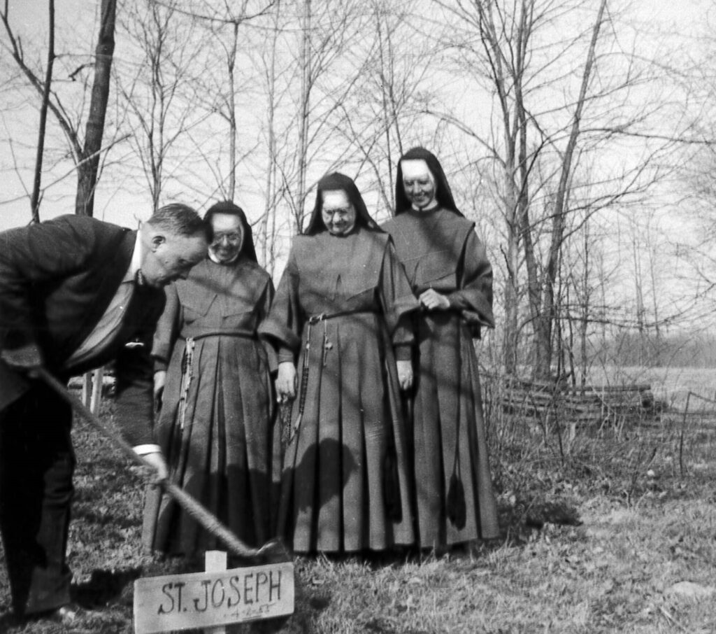 Mr. Roediger, contractor, Mother Clementine, Mother Carmelita, Sr. Generosa digging up the statue