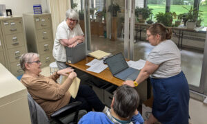 The WRAC team working around a table