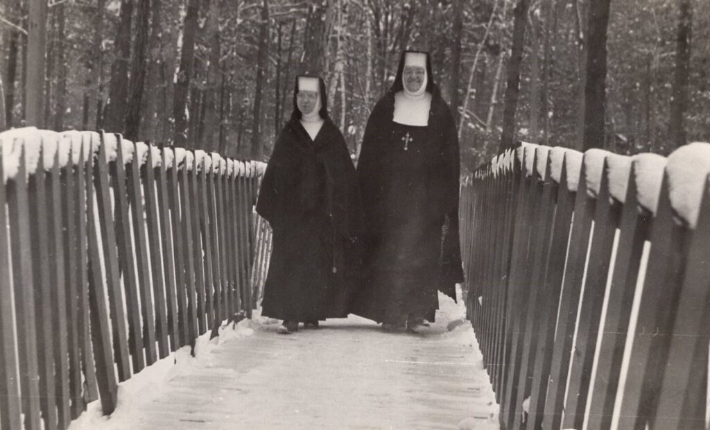 Sister Anatolia Kulas and Seraphica Bialozynski crossing the bridge