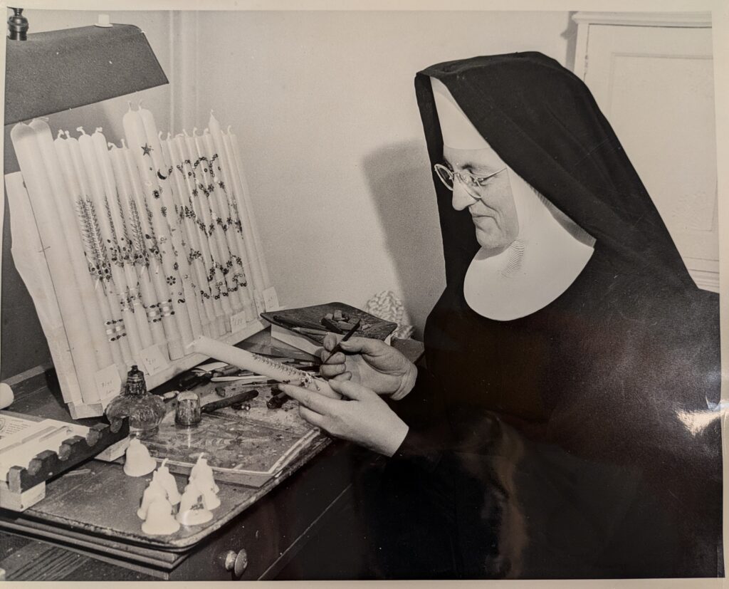 Sister Decorating a Candle